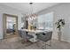 Elegant dining room with a modern chandelier, a large mirror, and a stylish table setting at 2845 High Pointe St, Clermont, FL 34711