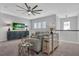 Upstairs living room featuring modern decor, comfortable seating, and a ceiling fan at 2845 High Pointe St, Clermont, FL 34711