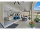 Covered patio featuring an outdoor dining area and access to the living room at 2845 High Pointe St, Clermont, FL 34711