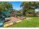 Inviting backyard with a wood deck, lounge chairs, and lush landscaping for outdoor enjoyment at 2904 Allison Dr, Orlando, FL 32826