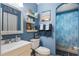 Stylish bathroom with blue walls, decorative shelves, and a shower with a coordinating curtain at 2904 Allison Dr, Orlando, FL 32826