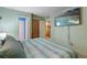 Comfortable bedroom featuring a mounted TV and relaxing decor for a serene living space at 2904 Allison Dr, Orlando, FL 32826