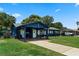 Inviting single-story home featuring a carport, well-kept lawn, and charming curb appeal for a welcoming atmosphere at 2904 Allison Dr, Orlando, FL 32826