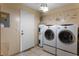 Well-equipped laundry room featuring modern washer and dryer units for convenient chores at 2904 Allison Dr, Orlando, FL 32826