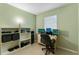 Functional home office space with ample desk space and shelving for organized work at 2904 Allison Dr, Orlando, FL 32826