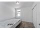 This bedroom offers carpet floors, a large window, and a closet with mirrored doors for ample storage at 29400 Caspian St, Leesburg, FL 34748
