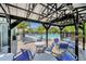 Inviting poolside seating area with covered tables and plenty of lounge chairs by the community pool at 29400 Caspian St, Leesburg, FL 34748