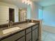 The bathroom features double sinks, granite countertops, updated cabinetry and fixtures, and a bathtub at 4326 Sagefield Dr, Harmony, FL 34773