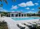 Resort-style community pool with lounge chairs, perfect for relaxation and recreation at 4326 Sagefield Dr, Harmony, FL 34773