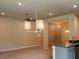 Open floor plan showcasing kitchen island with seating overlooking the dining and living areas at 4326 Sagefield Dr, Harmony, FL 34773