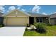 Charming single Gathering home featuring an attached two car garage and well manicured lawn at 4326 Sagefield Dr, Harmony, FL 34773