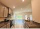 Open kitchen showcases stainless steel appliances and granite countertops at 4326 Sagefield Dr, Harmony, FL 34773