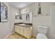 Bathroom featuring a granite countertop vanity, a toilet and tiled flooring at 4740 Walden Cir # 28, Orlando, FL 32811