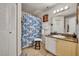 Bright bathroom featuring a vanity with granite countertop, white cabinets and tiled floors at 4740 Walden Cir # 28, Orlando, FL 32811