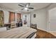 Bedroom featuring hardwood floors and a window with dark drapes at 4740 Walden Cir # 28, Orlando, FL 32811