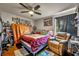 Cozy bedroom with hardwood floors and a ceiling fan offers a relaxing retreat at 4740 Walden Cir # 28, Orlando, FL 32811