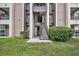 Apartment complex featuring well-maintained landscaping and staircases for easy access at 4740 Walden Cir # 28, Orlando, FL 32811
