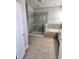 Bathroom featuring a glass shower, soaking tub, and modern fixtures at 5107 Appenine W Loop, St Cloud, FL 34771