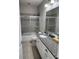 Bathroom with granite countertops, toilet and shower with glass door at 5107 Appenine W Loop, St Cloud, FL 34771