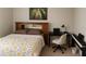 Cozy bedroom with a bed, desk, and artwork at 5107 Appenine W Loop, St Cloud, FL 34771