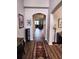 Elegant foyer with hardwood floors, arched doorway, and decorative furnishings at 5107 Appenine W Loop, St Cloud, FL 34771