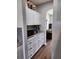 Additional kitchen counter space with white cabinets, modern appliances, and ample storage at 5107 Appenine W Loop, St Cloud, FL 34771
