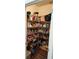 Walk-in pantry featuring wire shelving providing ample storage space at 5107 Appenine W Loop, St Cloud, FL 34771