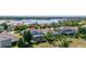 Aerial view of a home with screened pool, solar panels, and lake access in a vibrant community at 5365 Bowman Dr, Winter Garden, FL 34787