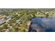 Aerial view of a lakefront community featuring a dock and waterfront properties, highlighting the unique lakeside living experience at 5365 Bowman Dr, Winter Garden, FL 34787