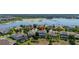 Wonderful aerial view of a neighborhood with lake access, swimming pools, and mature landscaping at 5365 Bowman Dr, Winter Garden, FL 34787