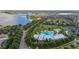 Stunning aerial view of a community pool and lake at 5365 Bowman Dr, Winter Garden, FL 34787