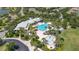 Aerial view of the community pool and neighborhood, surrounded by lush landscaping at 5365 Bowman Dr, Winter Garden, FL 34787