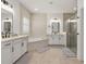 Bright bathroom featuring modern showers, sleek vanities and tile at 5365 Bowman Dr, Winter Garden, FL 34787