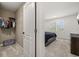 Bedroom view from walk-in closet entrance includes window with shutters and neutral walls at 5365 Bowman Dr, Winter Garden, FL 34787