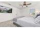 Bright bedroom with plush carpet features a ceiling fan, and comfortable bed at 5365 Bowman Dr, Winter Garden, FL 34787