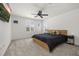 Bright bedroom features a ceiling fan, plush carpet, and a comfortable bed at 5365 Bowman Dr, Winter Garden, FL 34787