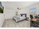 Bright bedroom with plush carpet features a ceiling fan, desk and work space, and comfortable bed at 5365 Bowman Dr, Winter Garden, FL 34787