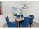 Charming dining area with modern light fixture and seating for four at 5365 Bowman Dr, Winter Garden, FL 34787