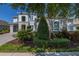 Beautiful home exterior with manicured landscaping, lush greenery and stone accents around the windows at 5365 Bowman Dr, Winter Garden, FL 34787
