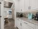 Modern kitchen with granite countertops, stainless steel appliances, and ample storage at 5365 Bowman Dr, Winter Garden, FL 34787