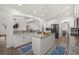 Open kitchen with a large island, stainless steel appliances, and granite countertops at 5365 Bowman Dr, Winter Garden, FL 34787