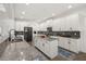 Spacious kitchen features stainless steel appliances, large island, granite countertops, and ample cabinet space at 5365 Bowman Dr, Winter Garden, FL 34787