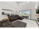 Open-concept living room with high ceilings, providing clear views to the outdoor pool and kitchen area at 5365 Bowman Dr, Winter Garden, FL 34787
