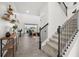 Spacious living room with staircase, modern decor, and view of the outdoor pool area at 5365 Bowman Dr, Winter Garden, FL 34787