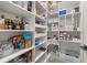 Walk-in pantry with custom shelving and ample storage space for organized provisions at 5365 Bowman Dr, Winter Garden, FL 34787