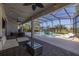Expansive, screened-in patio offers a relaxing outdoor living space overlooking the pool at 5365 Bowman Dr, Winter Garden, FL 34787