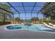 Stunning screened-in pool with lush landscaping, lounge chairs, and an inviting ambiance at 5365 Bowman Dr, Winter Garden, FL 34787