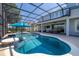Gorgeous screened pool with in-pool seating and lounge chairs for ultimate relaxation at 5365 Bowman Dr, Winter Garden, FL 34787