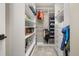 Spacious walk-in closet features custom shelving, drawers, and ample storage for clothing and accessories at 5365 Bowman Dr, Winter Garden, FL 34787