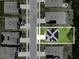 Aerial view of the home showing roof solar panels, driveway, yard, and proximity to neighboring houses at 6780 Coral Berry Dr, Mount Dora, FL 32757
